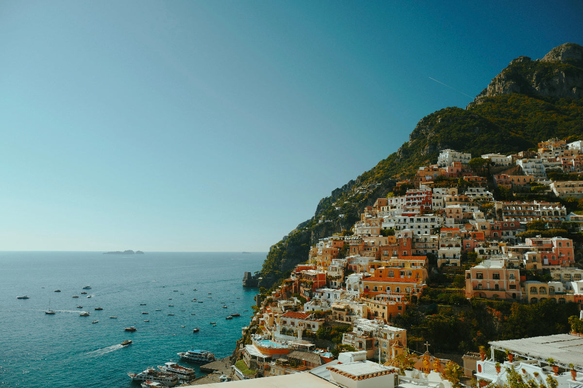 Hilly coastal town with colorful buildings overlooking the sea